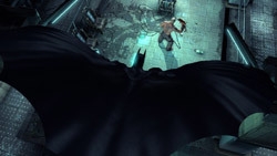 Batman gliding in on an enemy in Batman: Arkham Asylum